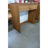 A teak single drawer side table