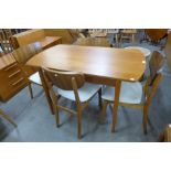 A teak dining table and four chairs