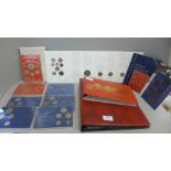 A collection of GB coin sets and an album of coins