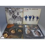 Four Beatles LP records, Rubber Soul, Help, Revolver and Let It Be