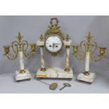 A French white marble and gilt metal clock garniture with porcelain dial, 38cm