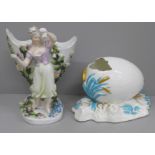 A German porcelain figural spill holder and egg ornament, both a/f