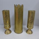 A trench art shell case vase and two brass vases