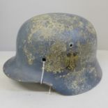 A German WWII SE64 helmet shell, post war decal