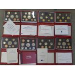 Eight Royal Mint proof coin sets