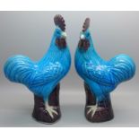 A pair of blue glazed cockerel figures, 19.5cm