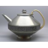 A Norwegian Savo pewter teapot with cane bound handle