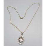 A 9ct gold and diamond pendant and chain, 3.5g