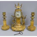 A 19th Century French yellow marble and gilt metal clock garniture, with cupid, the porcelain dial