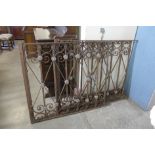 A pair of French wrought iron and lead gates