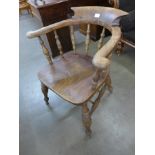 A Victorian elm and beech smokers bow chair