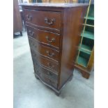 A mahogany serpentine chest of drawers