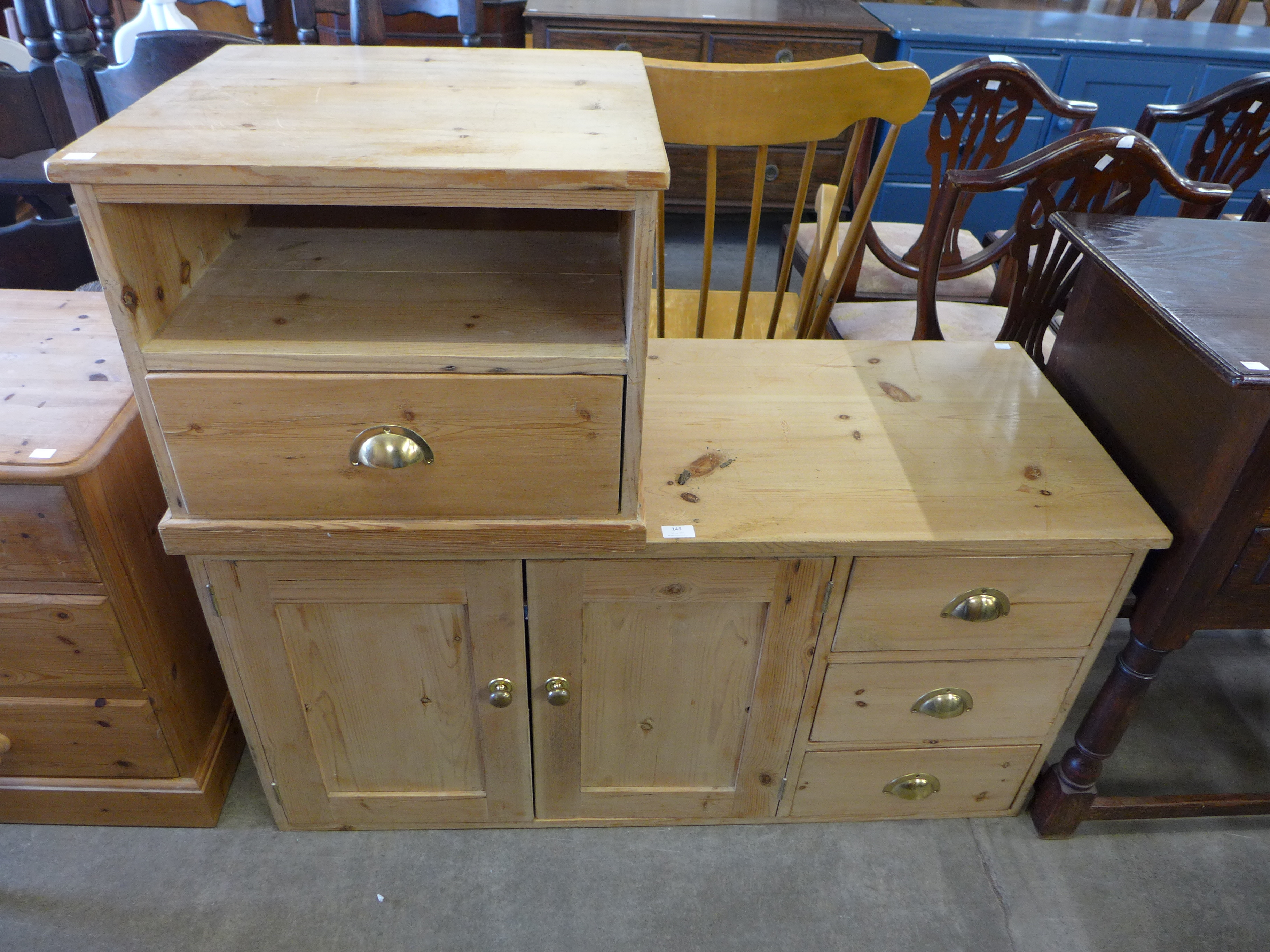 A pine kitchen cabinet and a table