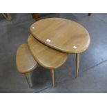 An Ercol Blonde elm and beech pebble shaped nest of tables