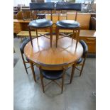 A G-Plan Fresco circular teak extending dining table and six chairs