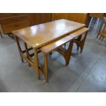 A Stonehill Stateroom teak nest of tables