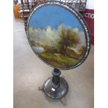 A 19th Century continental ebonised and papier mache topped circular tilt-top tripod table, hand