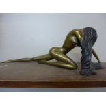 An Art Deco style brass figure of a female nude