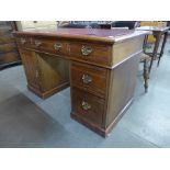 A Victorian ash pedestal desk