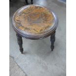 An Arts and Crafts painted beech three legged stool