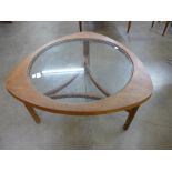 A Nathan teak and glass topped coffee table