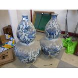 A pair of Chinese blue and white stoneware double gourd shaped vases