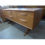 An Austin Suite teak six drawer sideboard