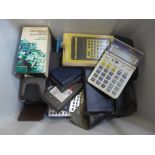 A box of Casio, Commodore and other vintage calculators