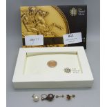 A 2011 quarter sovereign, boxed and scrap gold