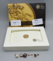 A 2011 quarter sovereign, boxed and scrap gold