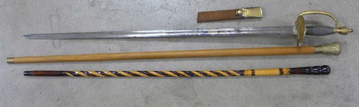 A 1796 infantry sword with blue and gilt blade, with two walking sticks