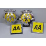 A collection of four AA car badges