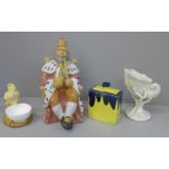 Assorted pottery including a chick egg cup, nautilus shell vase, model of a king on the throne, etc.