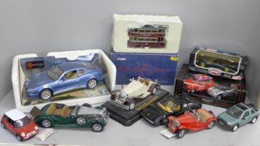 A collection of model vehicles including Burago and Corgi