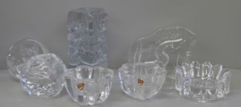 Seven items of clear glass including an Orrefors bowl, Kosta Boda tea light holder and otter