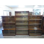 Two Minty Oxford mahogany three tier sectional stacking bookcases and a Simplex mahogany five tier