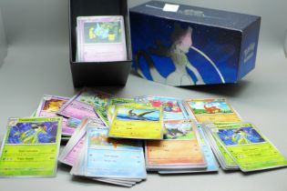 300 Pokemon cards from sets Scarlet and Violet, Paldea Evolved and Obsidian Hames with dice, coins