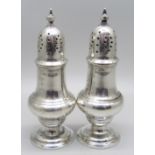 A pair of silver peppers, Birmingham 1929, 97g