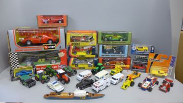 A box of die-cast model vehicles, Burago, Corgi, Matchbox, etc.