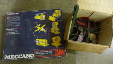 A Meccano motorised set and additional Meccano spare parts