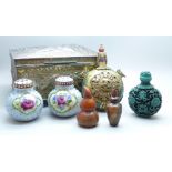 An oriental box, four bottles and two ceramic hand painted ceramic globular peppers