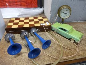 A 1980s telephone in the form of a car, a chess set and board/box, (lacking one piece), a set of