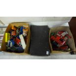 A collection of die-cast model vehicles including a case full of early Dinky Toys, playworn
