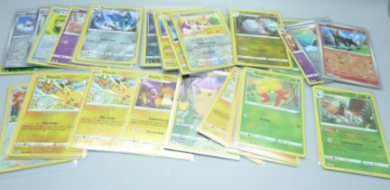 Over 50 holo and reverse holo Pokemon cards from sets Scarlet and Violet, Evolving Skies, etc.,