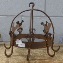 A vintage French metal meat hanger with cockerel detail