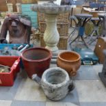 Three assorted planters and a concrete bird bath on pedestal