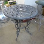 A cast alloy garden table