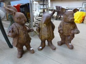 A set of three cast iron Beatrix Potter garden figures