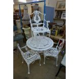 A painted cast alloy garden table and four chairs