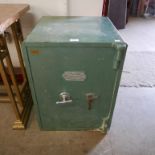 A W.E. Brain & Co. cast iron safe, with key